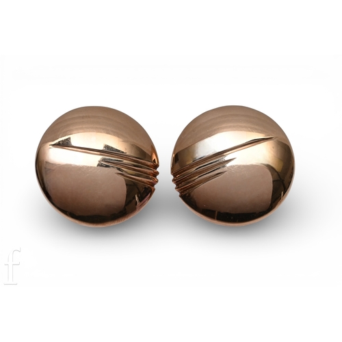 152 - A pair of 9 carat gold earrings, the domed circular discs with linear detail to the front, post and ... 