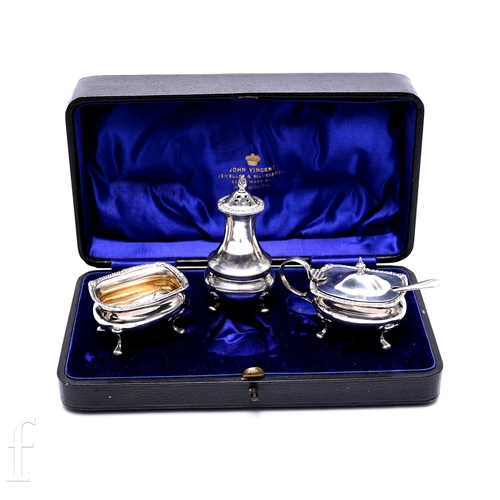 523 - An Edward VII cased silver three piece cruet, Chester 1908, maker's marks rubbed, comprising pepper ... 