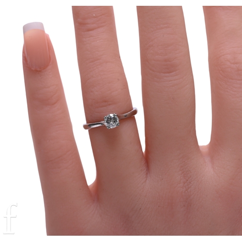 189 - A single stone diamond ring, the brilliant-cut diamond four claw set in white precious metal, unmark... 