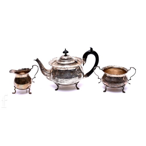 531 - An Edward VII silver three piece tea set, William Aitken, Birmingham 1905, comprising teapot fitted ... 