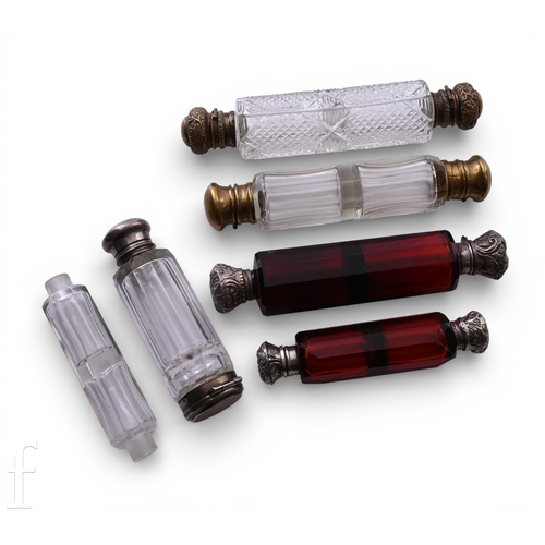 466 - A collection of 19th Century double ended scent bottles to include two ruby glass bottles with facet... 