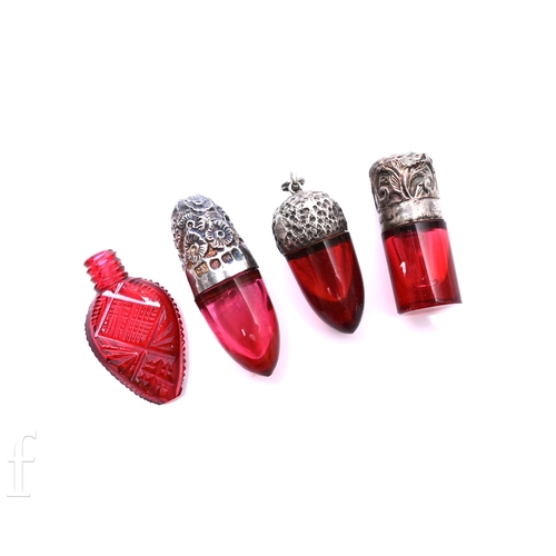 467 - A collection of 19th/early 20th Century ruby glass scent flasks, comprising a torpedo shaped example... 