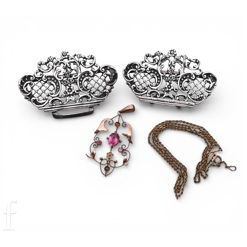 92 - An Art Nouveau 9 carat gold pendant, of scroll work design, set with pink stone highlights, marked 9... 