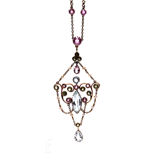 183 - An Art Nouveau aquamarine, topaz, peridot, seed pearl and gold pendant, the marquise-cut aquamarine ... 
