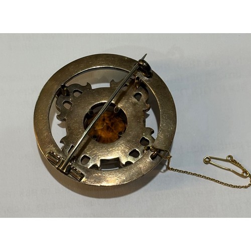 40 - A late Victorian Scottish agate and Cairngorm brooch, circa 1880, the circular mixed-cut Cairngorm c... 