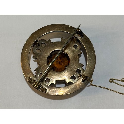 40 - A late Victorian Scottish agate and Cairngorm brooch, circa 1880, the circular mixed-cut Cairngorm c... 