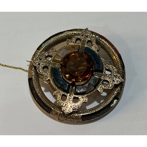 40 - A late Victorian Scottish agate and Cairngorm brooch, circa 1880, the circular mixed-cut Cairngorm c... 