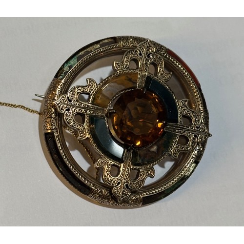 40 - A late Victorian Scottish agate and Cairngorm brooch, circa 1880, the circular mixed-cut Cairngorm c... 