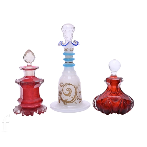 442 - A mid 19th Century Bohemian scent bottle of low shouldered form decorated with gilded scrolls over t... 