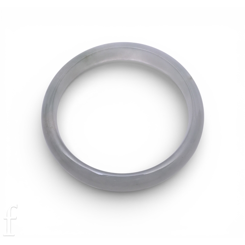 147 - A semi-cylindrical jadeite bangle of colourless material, inner diameter 5.5cm, outer diameter appro... 