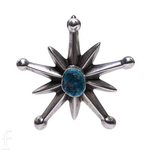 173 - A turquoise set Navajo pendant, designed as a ten rayed star with turquoise set to the centre, penda... 