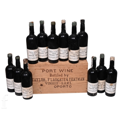 A case of twelve bottles of Taylor's 1963 Vintage Port, bottled in 1966, all in original wooden case. (12)