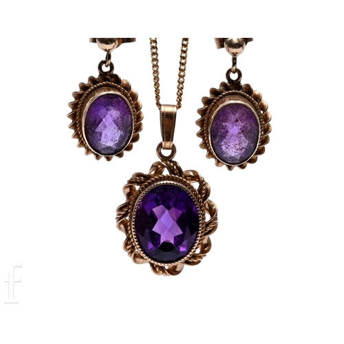 150 - A 9ct single stone amethyst pendant to a rope twist border and suspended from a 9ct chain with a mat... 