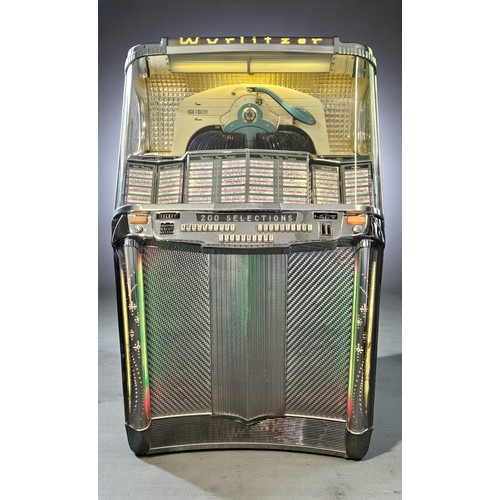 A Wurlitzer Jukebox "The Centennial 2000", circa 1956, manufactured by the Rudolph Wurlitzer co of North Tonawanda N.Y. USA, capacity of 100 x 45 rpm singles, so 200 selections are available, this represents an increase of 48 records when compared to the other Centennial model, the 1900, it features a motorised roto-page selection system for the title cards and features the then newly introduced carousel system and Zenith Cobra tone arm manufactured by the Zenith Radio Corporation, it also features illuminated pilasters and a valve driven sound system, serial number 271630.