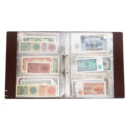 48 - Banknotes - An album of assorted world notes to include a 1965 Nigerian one pound note, Bulgarian St... 