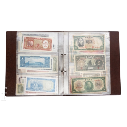 48 - Banknotes - An album of assorted world notes to include a 1965 Nigerian one pound note, Bulgarian St... 