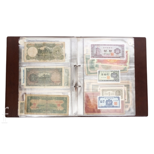 48 - Banknotes - An album of assorted world notes to include a 1965 Nigerian one pound note, Bulgarian St... 