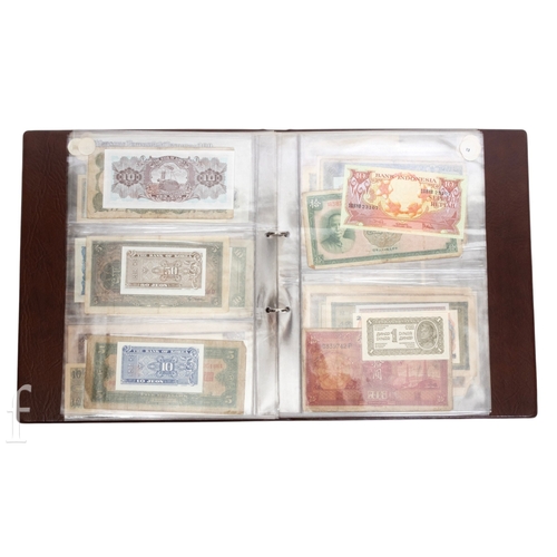 48 - Banknotes - An album of assorted world notes to include a 1965 Nigerian one pound note, Bulgarian St... 