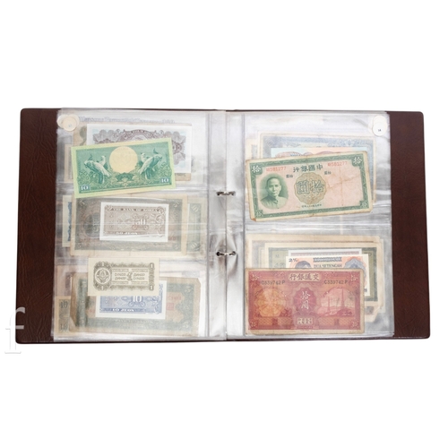 48 - Banknotes - An album of assorted world notes to include a 1965 Nigerian one pound note, Bulgarian St... 