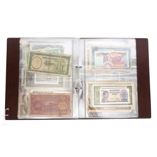 48 - Banknotes - An album of assorted world notes to include a 1965 Nigerian one pound note, Bulgarian St... 
