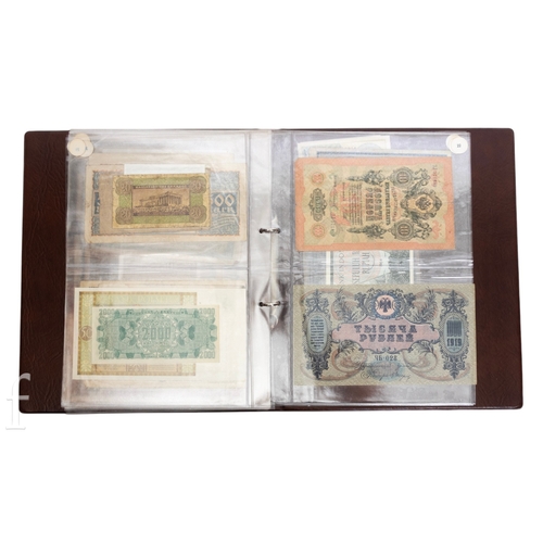 48 - Banknotes - An album of assorted world notes to include a 1965 Nigerian one pound note, Bulgarian St... 