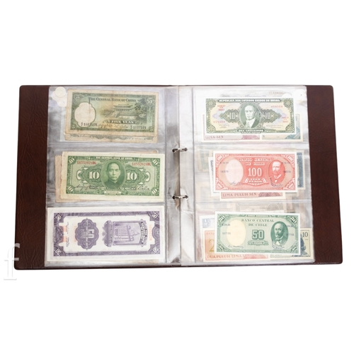 48 - Banknotes - An album of assorted world notes to include a 1965 Nigerian one pound note, Bulgarian St... 