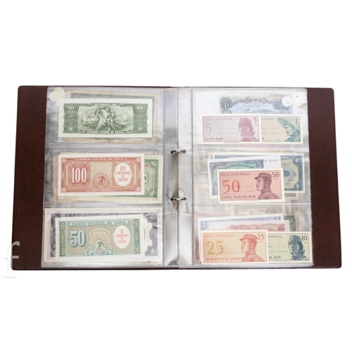 48 - Banknotes - An album of assorted world notes to include a 1965 Nigerian one pound note, Bulgarian St... 