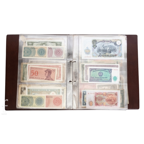 49 - Banknotes - An album of assorted world notes to include a 1965 Nigerian one pound note, Bulgarian St... 