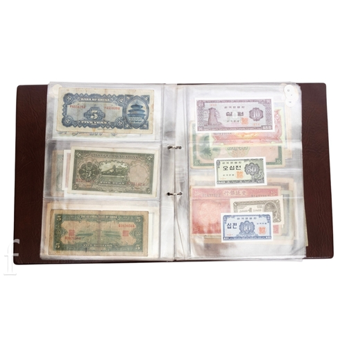 49 - Banknotes - An album of assorted world notes to include a 1965 Nigerian one pound note, Bulgarian St... 