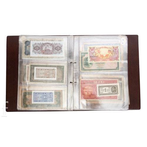 49 - Banknotes - An album of assorted world notes to include a 1965 Nigerian one pound note, Bulgarian St... 