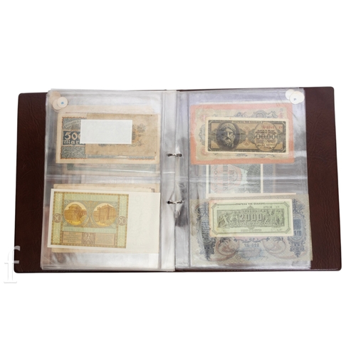 49 - Banknotes - An album of assorted world notes to include a 1965 Nigerian one pound note, Bulgarian St... 