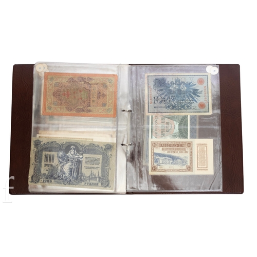 49 - Banknotes - An album of assorted world notes to include a 1965 Nigerian one pound note, Bulgarian St... 