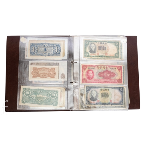 49 - Banknotes - An album of assorted world notes to include a 1965 Nigerian one pound note, Bulgarian St... 