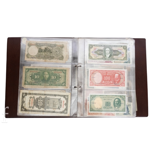 49 - Banknotes - An album of assorted world notes to include a 1965 Nigerian one pound note, Bulgarian St... 
