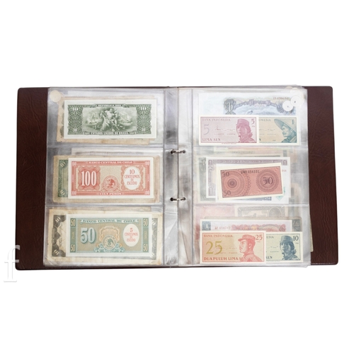 49 - Banknotes - An album of assorted world notes to include a 1965 Nigerian one pound note, Bulgarian St... 