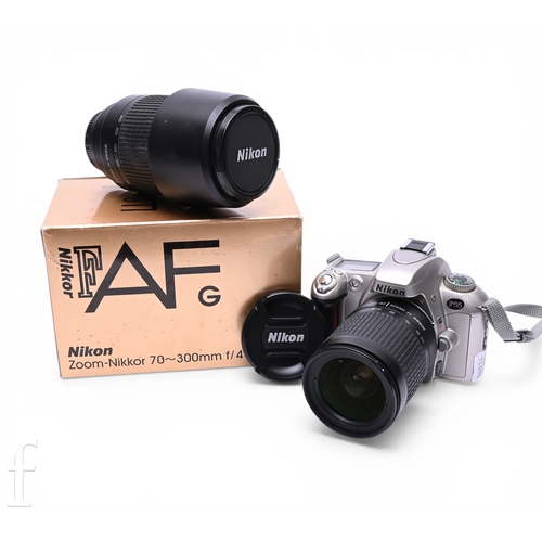 156 - A Nikon F55 35mm SLR camera, the silver and black body with an AF Nikkor 28-100mm 1:3.5-5.6 G lens, ... 