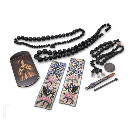 254 - A 19th Century papier mache spectacle case painted with a maiden, a 1920s Egyptian themed enamel pen... 