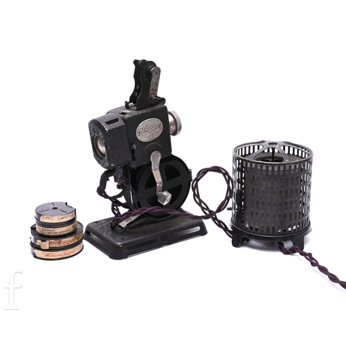 296 - A 1920s to early 1930s Pathescope 'Kid' projector with drum heater attachment and four spools of fil... 