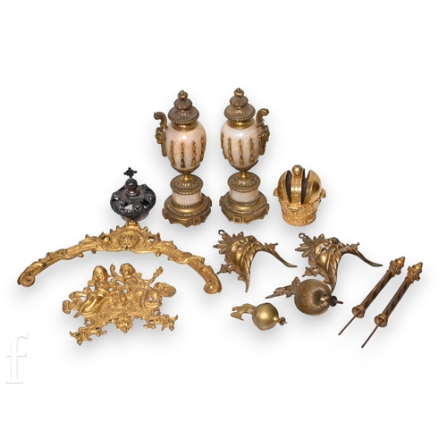 322 - A pair of gilt brass mask mounts, a coronet top, large cherub embellishment, a pair of garnitures an... 