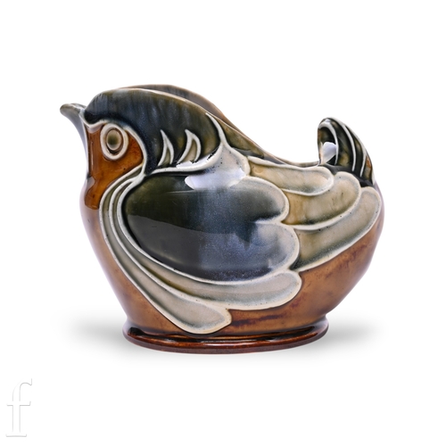 837 - A Doulton Lambeth stoneware spoon warmer designed by Mark V. Marshall, modelled as a stylised seated... 