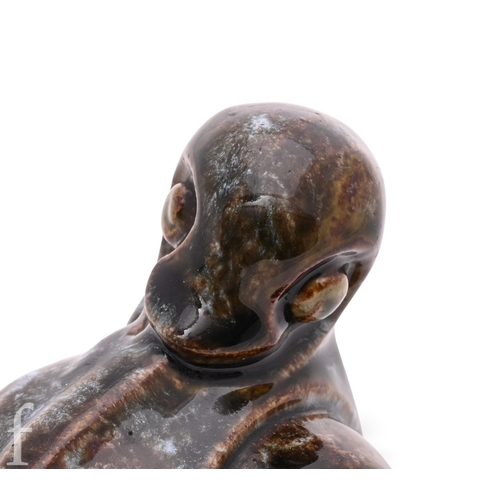 838 - A Doulton Lambeth stoneware figure of a grotesque 'Duck' modelled by Mark V Marshall, picked out in ... 