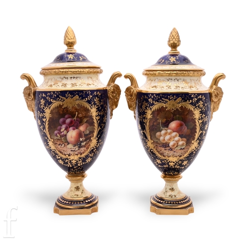 845 - A pair of Coalport pedestal vases, the shield shape body with applied rams head mask handles below a... 