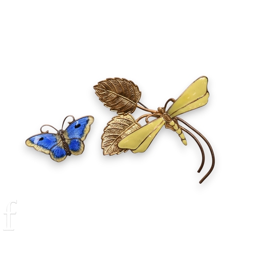 101 - An Art Nouveau enamel dragonfly brooch, with yellow enamel to the body and wings, on a gilt metal fl... 