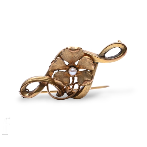 104 - An Art Nouveau gold and pearl brooch, circa 1890, the flower head set with a single pearl to the cen... 