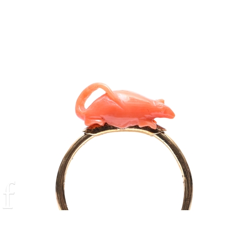 113 - Nicholls & Plincke (1829-1898), a coral and gold ring, the coral carved to depict a rodent, moun... 