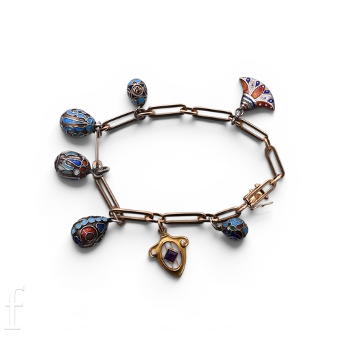 115 - A continental gold bracelet, suspending five cloisonne enamel and silver egg pendants, and enamel eg... 