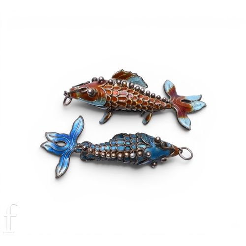 68 - A pair of enamel cloisonne articulated fish pendants, in tonal blues and burnt oranges, length 5cm. ... 