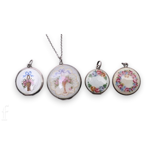 71 - Four white metal and enamelled lockets, each of circular form with floral garlands and flower filled... 