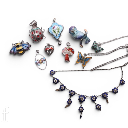 73 - An early 20th Century white metal and enamelled pendant on chain, of tri-lobed form, decorated with ... 