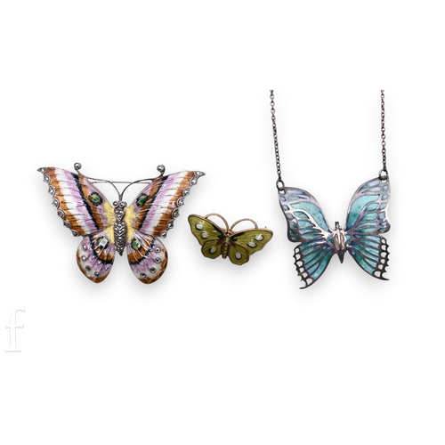 75 - A silver butterfly pendant by Norman Grant, relief cast champleve style blue enamelled decoration, o... 